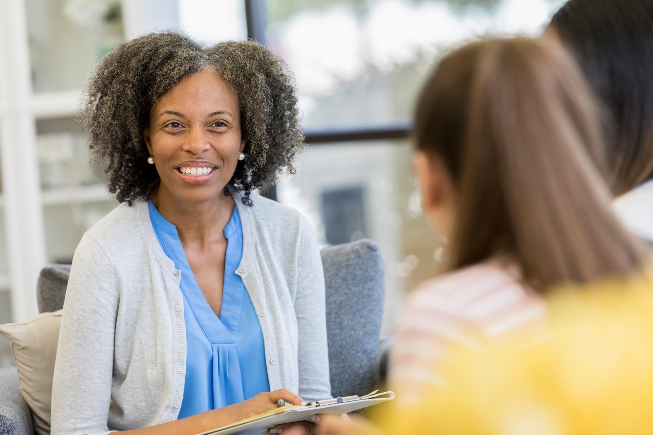 woman guidance counselor talking with students